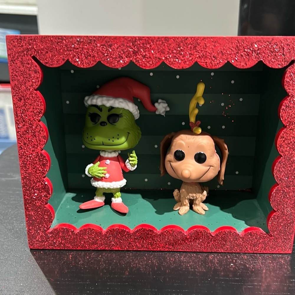 Funko grinch and Max in a display box